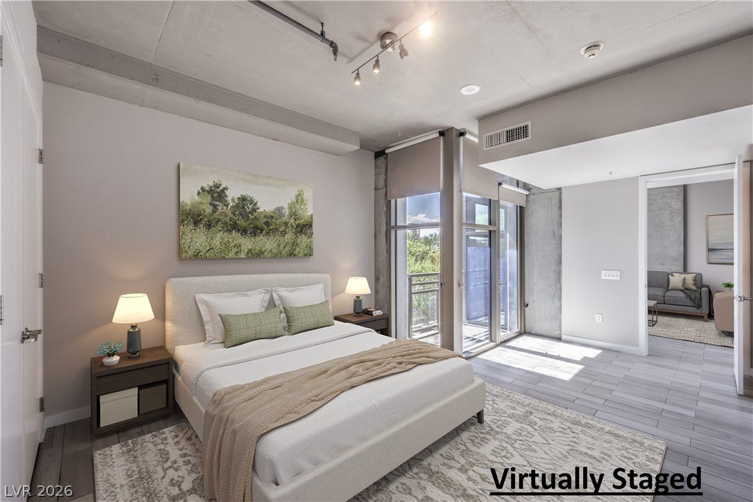 353 E Bonneville Avenue, #754, Las Vegas, NV 89101 Virtually Staged - Spacious Owners Suite with Balcony and Bathroom with Tile Flooring, Dual Sinks, and Tub/Shower Combination with Enclosure