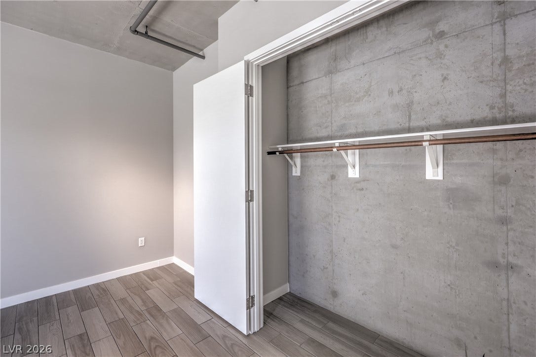 353 E Bonneville Avenue, #754, Las Vegas, NV 89101 Spacious Owners Suite with Balcony and Bathroom with Tile Flooring, Dual Sinks, and Tub/Shower Combination with Enclosure