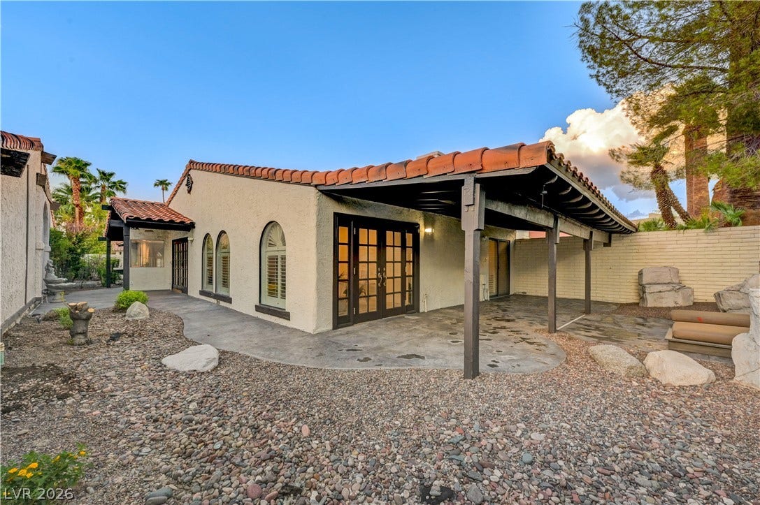 3005 Plaza De Rosa, Las Vegas, NV 89102 A spacious covered patio sits alongside the stucco exterior and Spanish tile roofline.