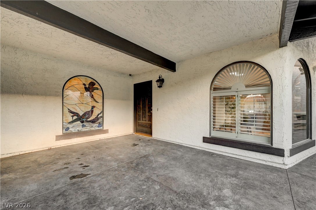 3005 Plaza De Rosa, Las Vegas, NV 89102 An inviting entryway welcomes guests with custom stained glass and architectural arches.