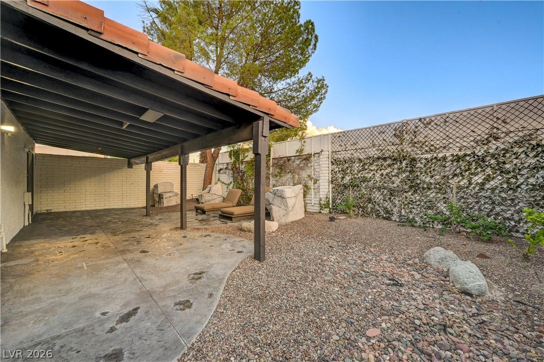 3005 Plaza De Rosa, Las Vegas, NV 89102 An inviting covered patio opens to a private low-maintenance yard bordered by privacy fencing.