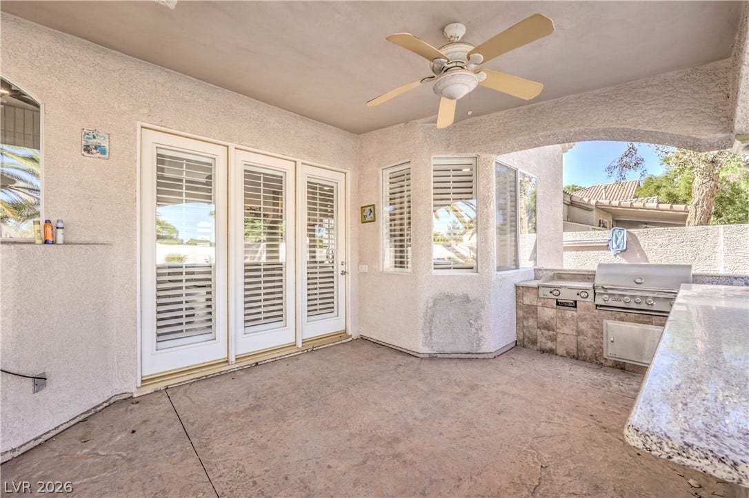 1863 Bogey Way, Henderson, NV 89074 Sheltered outdoor cooking area pairs textured concrete underfoot with durable stone countertops.