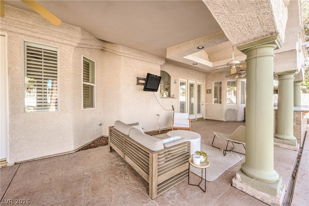 1863 Bogey Way, Henderson, NV 89074 Massive support columns frame a shaded concrete patio perfect for outdoor leisure.