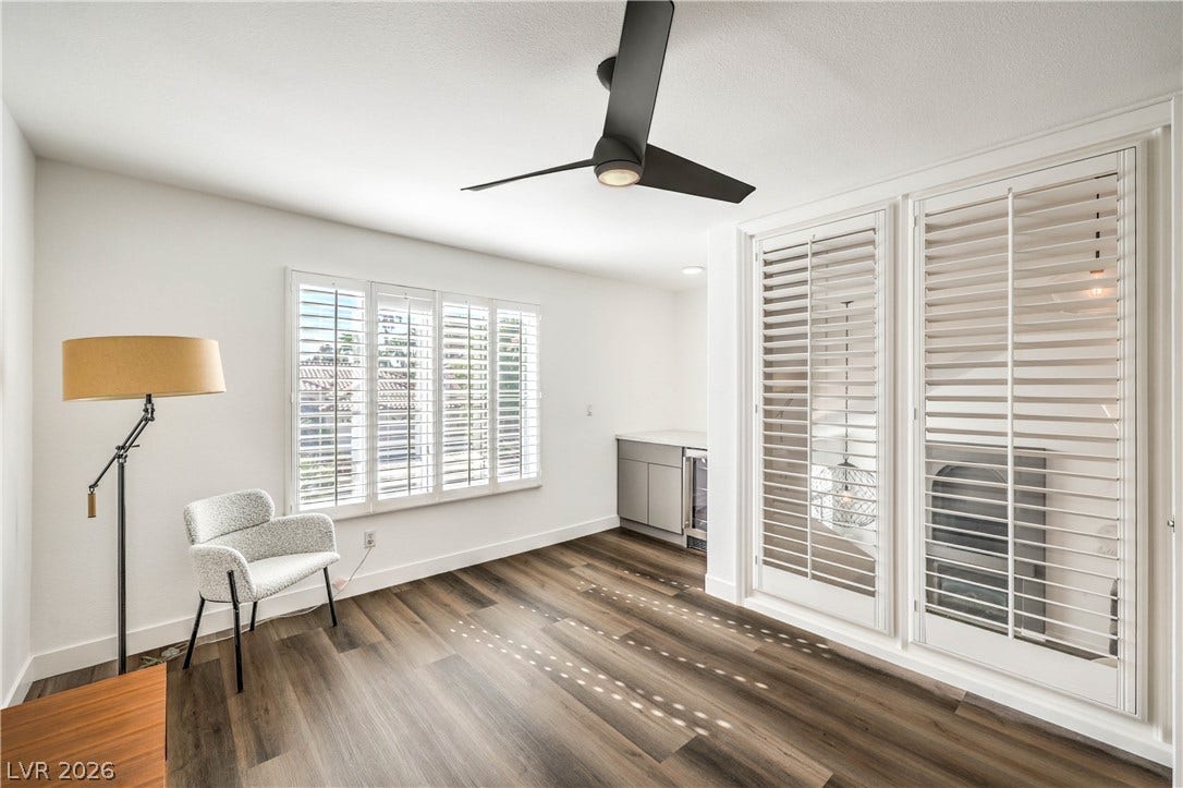 1863 Bogey Way, Henderson, NV 89074 Gleaming hardwood floors and classic plantation shutters highlight this versatile living area.
