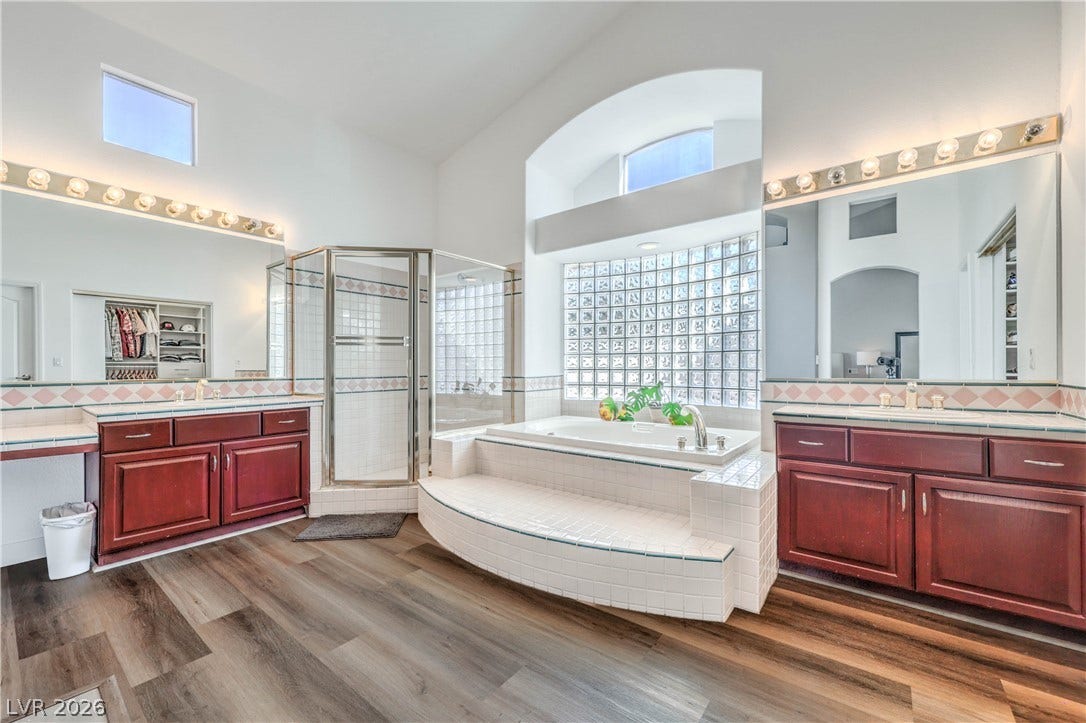 1863 Bogey Way, Henderson, NV 89074 High ceilings and a tiled soaking tub create an airy, spa-like atmosphere in this bathroom.