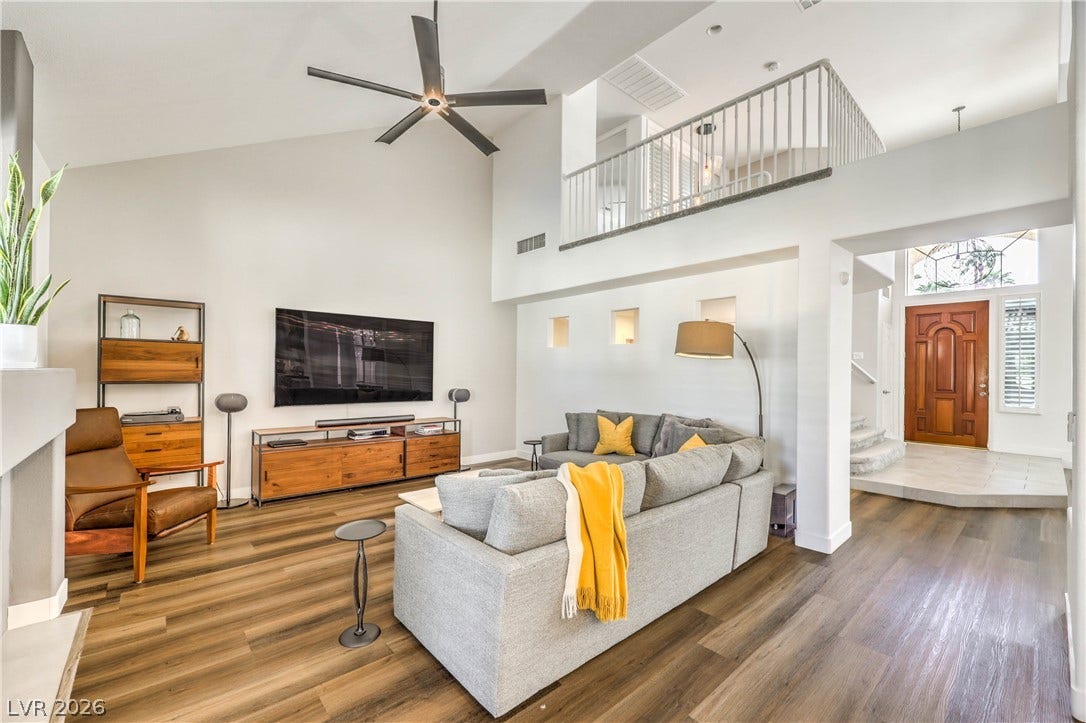 1863 Bogey Way, Henderson, NV 89074 High ceilings and warm wood floors define this welcoming living space.