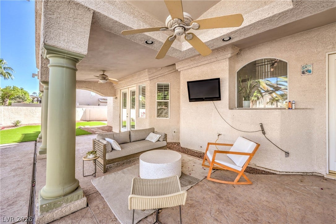 1863 Bogey Way, Henderson, NV 89074 An inviting covered patio features stamped concrete flooring and elegant architectural columns.