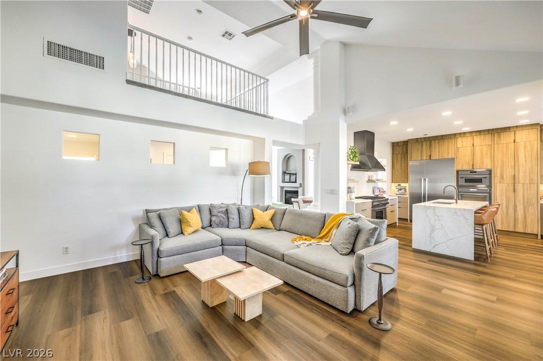 1863 Bogey Way, Henderson, NV 89074 Rich wood floors lay a warm foundation below soaring vaulted ceilings in this open layout.