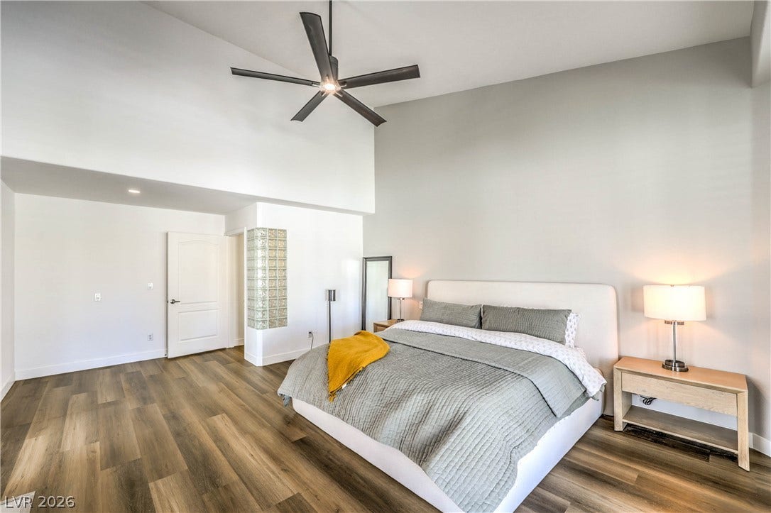 1863 Bogey Way, Henderson, NV 89074 Voluminous ceilings and handsome wood flooring define this restful private retreat.