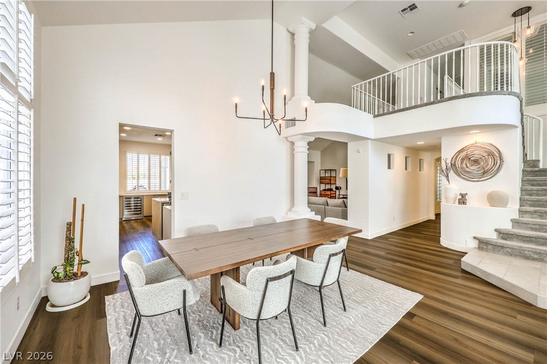 1863 Bogey Way, Henderson, NV 89074 Dramatic high ceilings and rich wood floors anchor this open-concept dining space.