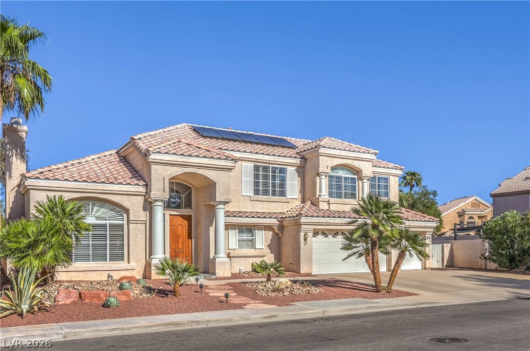 1863 Bogey Way, Henderson, NV 89074 Spanish tile rooflines and stucco exterior walls elevate this two-story residential design.