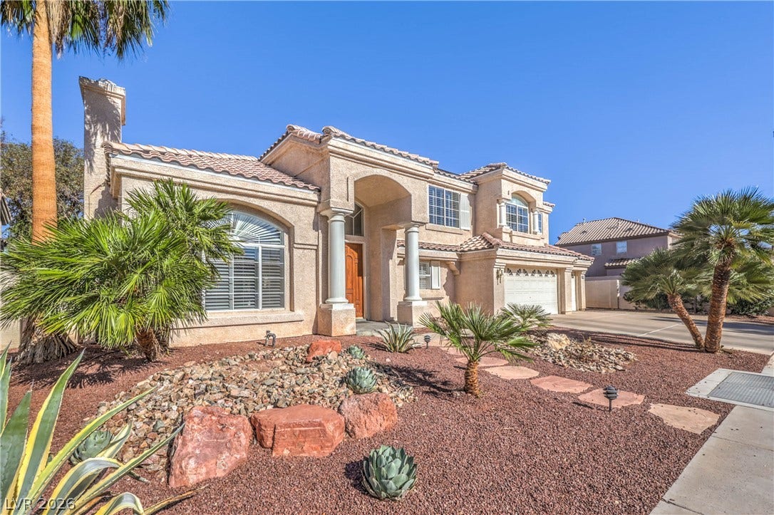 1863 Bogey Way, Henderson, NV 89074 Elegant two-story exterior featuring classical columns, tiled rooflines, and desert landscaping.