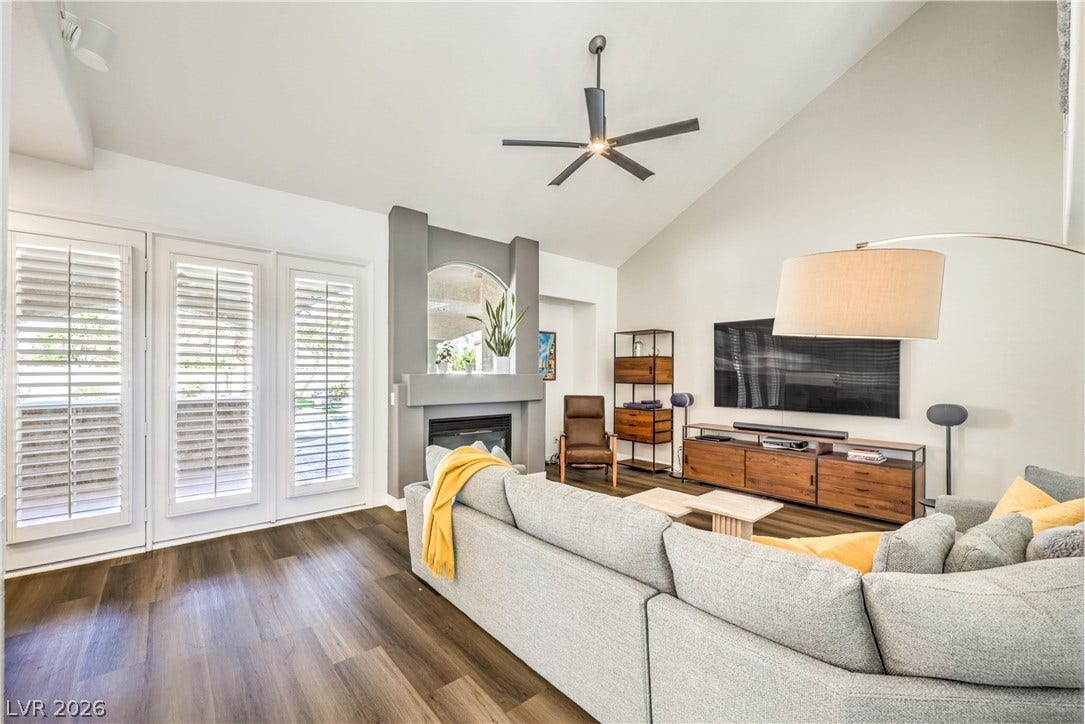 1863 Bogey Way, Henderson, NV 89074 Vaulted ceilings and rich wood floors anchor this comfortable modern living area.