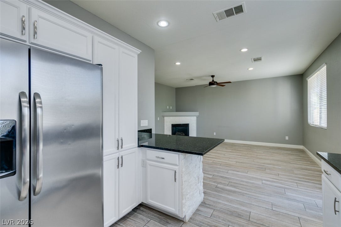 An open floor plan connects the kitchen space directly to the main living area.