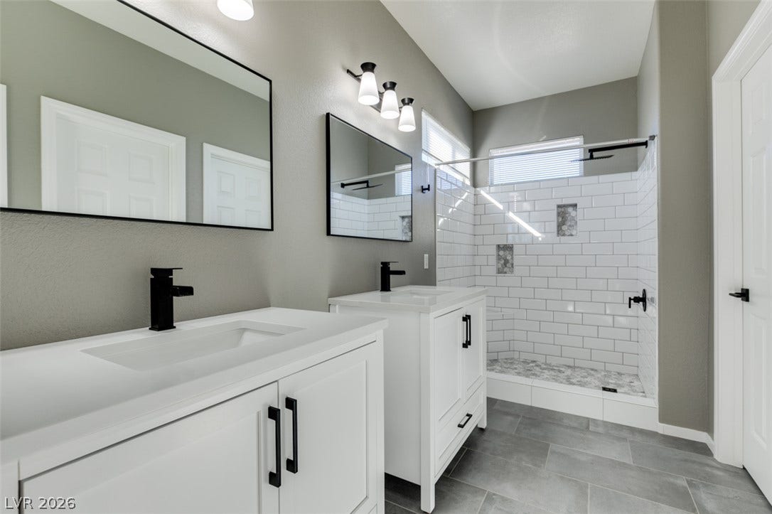 Clean lines and modern tile finishes define this updated bathroom space.