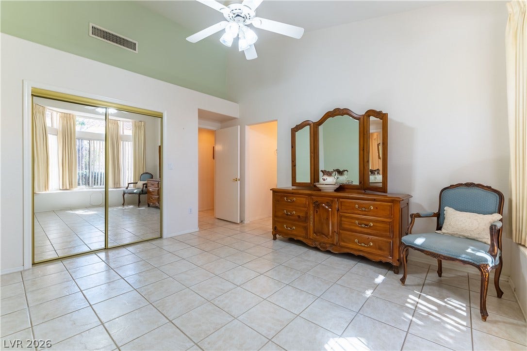 10005 Arbuckle Drive, Las Vegas, NV 89134 High vaulted ceilings and tiled flooring elevate this comfortable space.