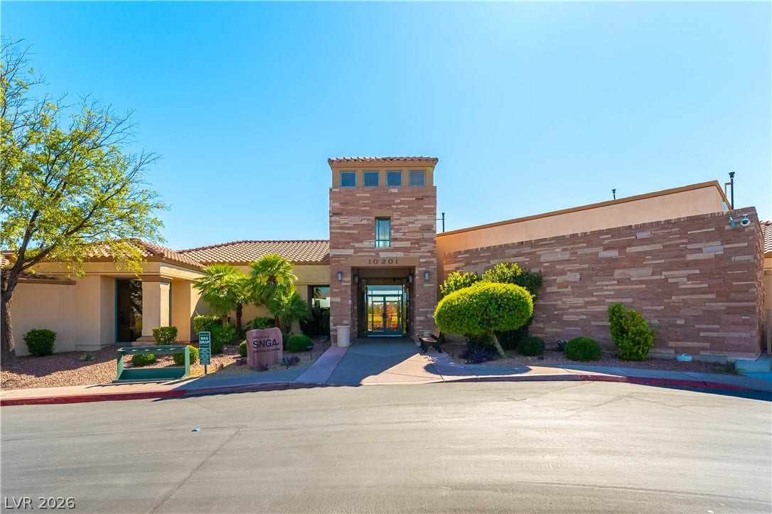 10005 Arbuckle Drive, Las Vegas, NV 89134 A striking stone and stucco facade frames the welcoming entrance of this desert-style structure.