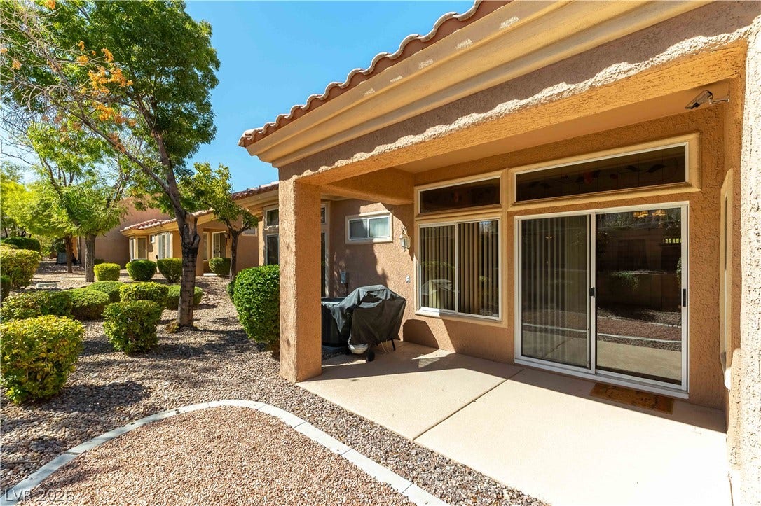 10005 Arbuckle Drive, Las Vegas, NV 89134 A covered concrete patio overlooks the low-maintenance desert landscaping.