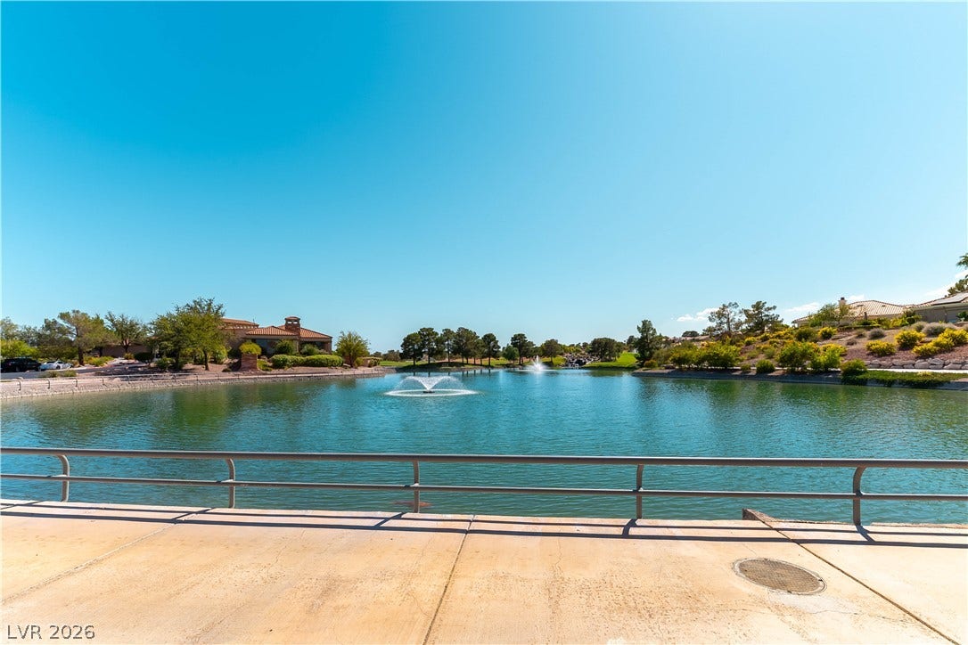 10005 Arbuckle Drive, Las Vegas, NV 89134 Serene water views over the pond with fountains highlight the peaceful surrounding neighborhood.