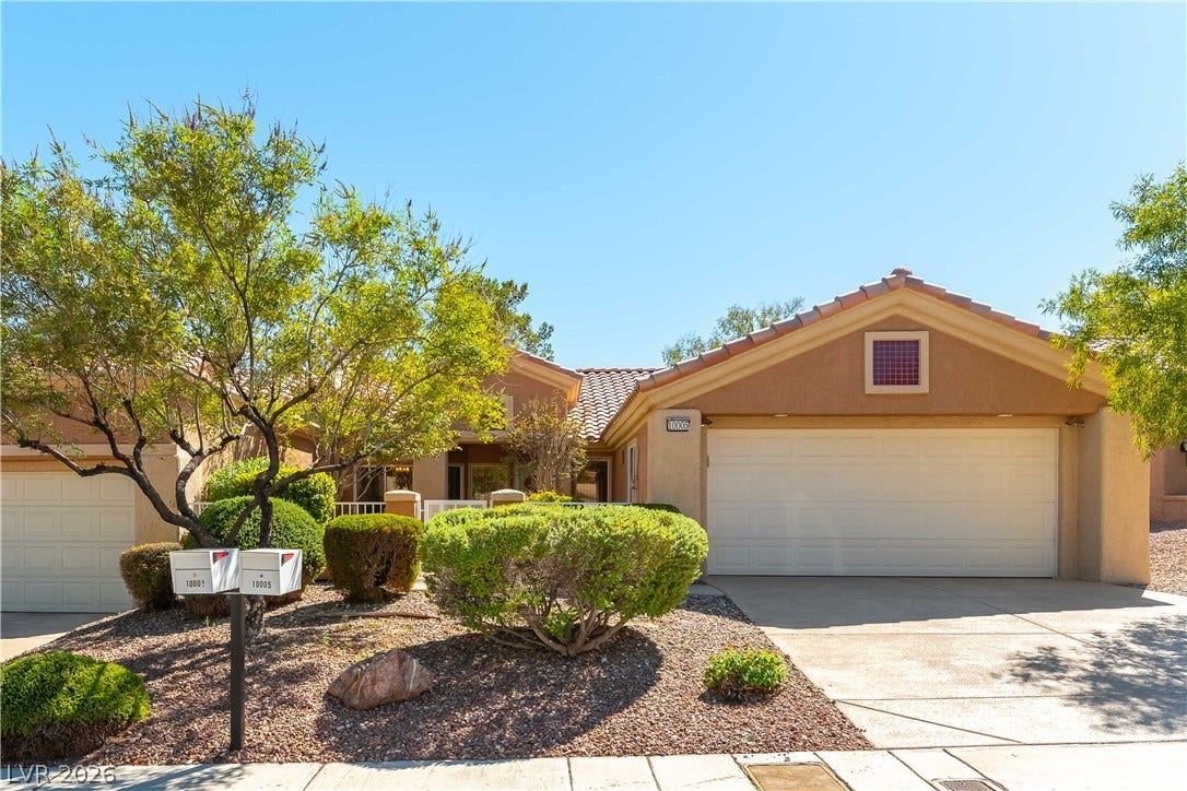 10005 Arbuckle Drive, Las Vegas, NV 89134 Desert landscaping and a tiled roof enhance the curb appeal of this classic stucco exterior.