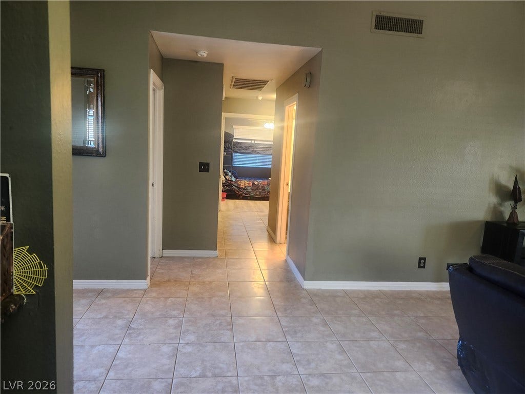 3126 Belvedere Drive, Henderson, NV 89014 Durable tile flooring runs throughout this open hallway connecting living spaces and bedrooms.