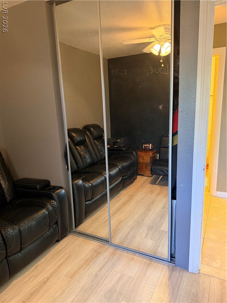 3126 Belvedere Drive, Henderson, NV 89014 Sliding mirrored closet doors reflect the interior details and wood-look flooring of this versatile space.
