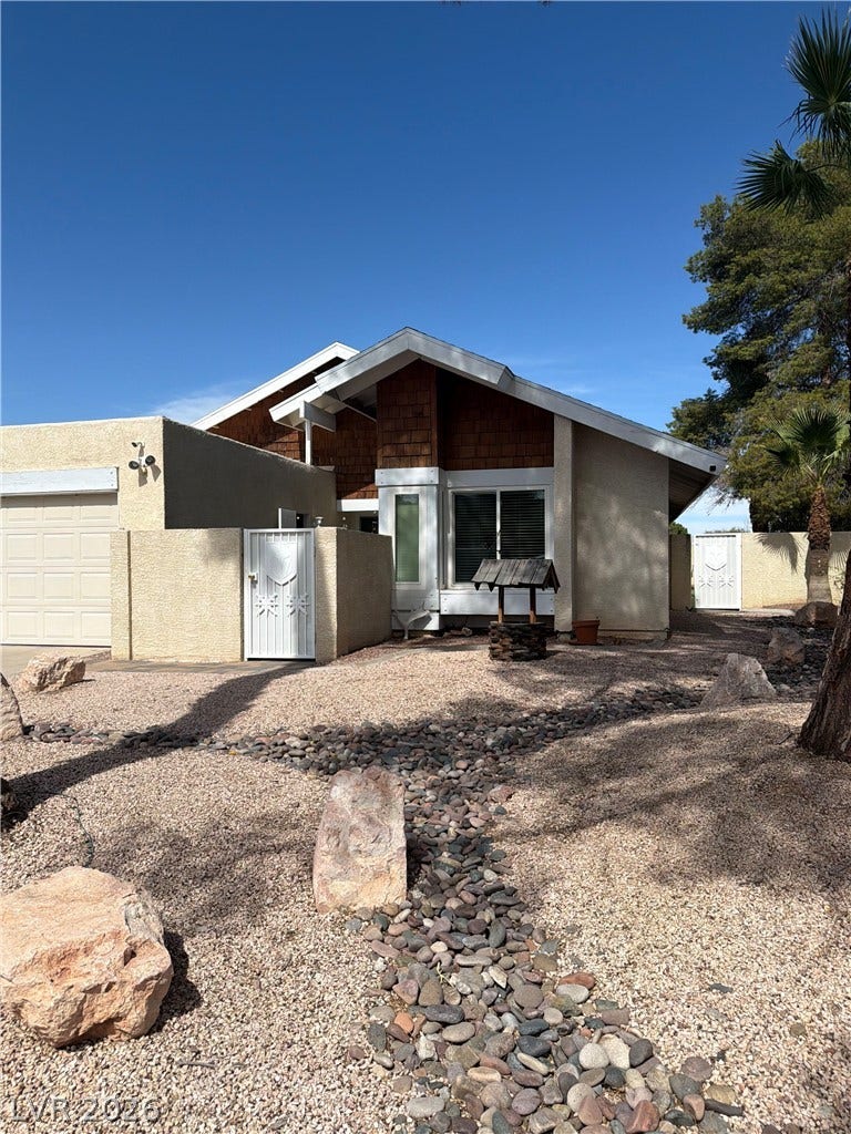 3126 Belvedere Drive, Henderson, NV 89014 Distinctive mid-century lines and low-maintenance desert landscaping define this unique property facade.