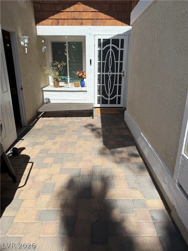 3126 Belvedere Drive, Henderson, NV 89014 An inviting entryway courtyard features handsome paver stone flooring leading to the front door.