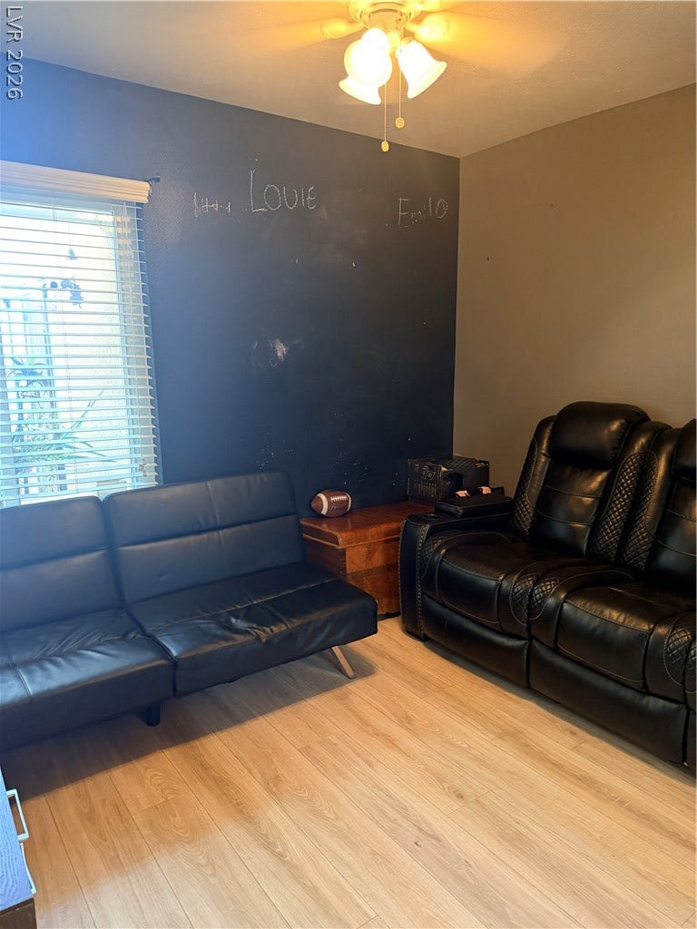 3126 Belvedere Drive, Henderson, NV 89014 Smooth wood floors and a wide window bring light into this versatile living area.
