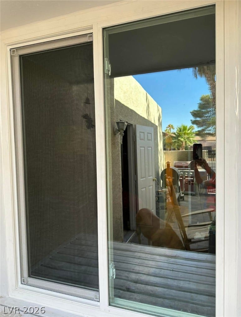 3126 Belvedere Drive, Henderson, NV 89014 Large sliding glass doors open to reveal views of the outdoor patio space.