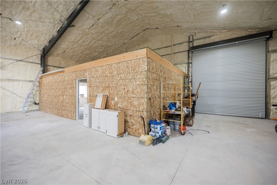 601 Sandy Drive, Henderson, NV 89002 An expansive concrete floor and insulated vaulted ceilings define this versatile workshop space.