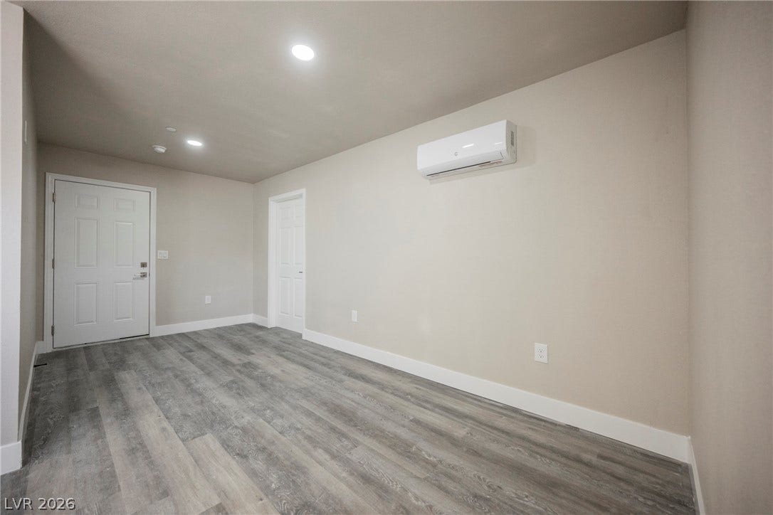601 Sandy Drive, Henderson, NV 89002 Recessed lighting and durable wood-look flooring enhance this versatile living space.