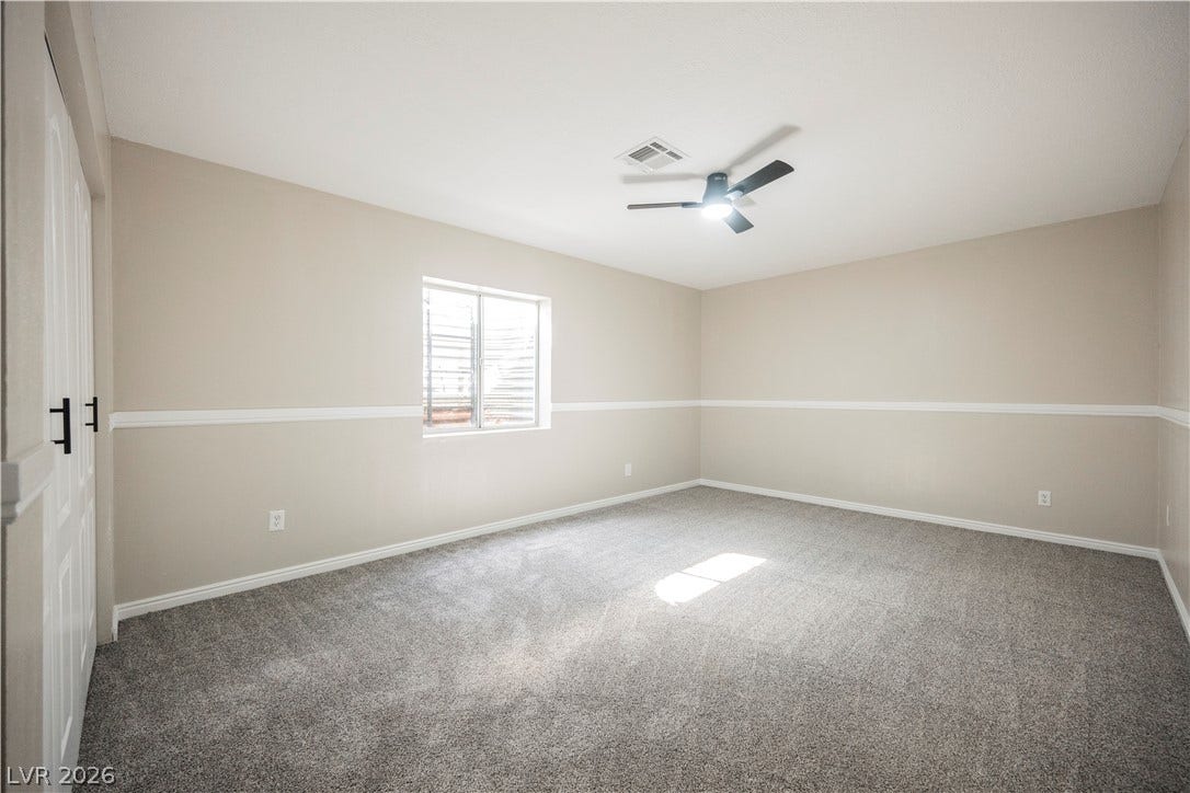 601 Sandy Drive, Henderson, NV 89002 Plush carpeting and classic chair rail molding define this versatile basement bedroom.