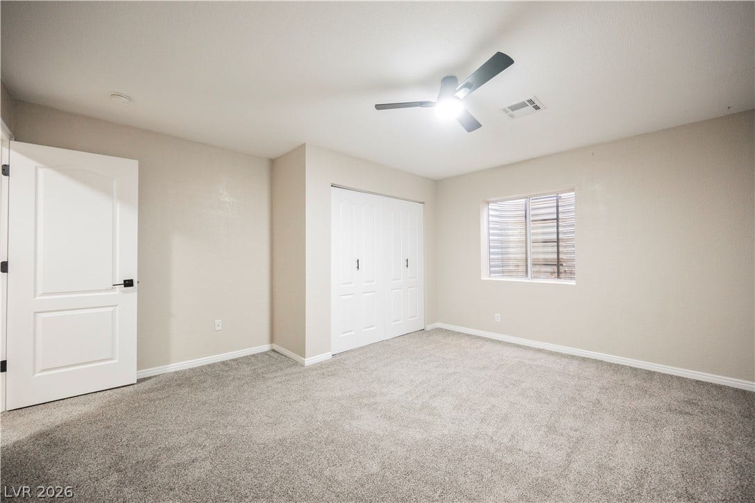 601 Sandy Drive, Henderson, NV 89002 Plush carpeting and neutral walls define this versatile bedroom with a built-in closet.