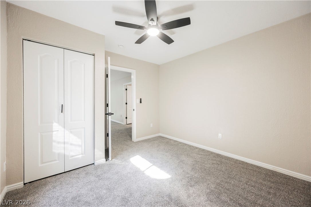 601 Sandy Drive, Henderson, NV 89002 Plush carpeting and textured walls define this comfortable bedroom space.