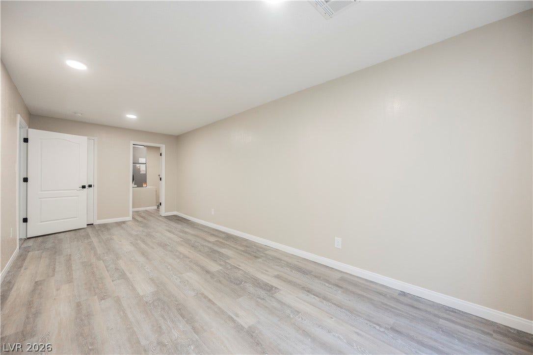 601 Sandy Drive, Henderson, NV 89002 Clean lines and durable vinyl plank flooring define this versatile interior space.