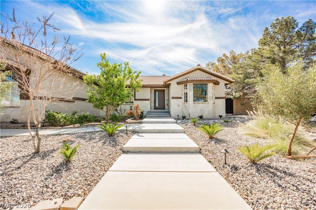 601 Sandy Drive, Henderson, NV 89002 A concrete walkway leads through low-maintenance desert landscaping to the inviting front entrance.