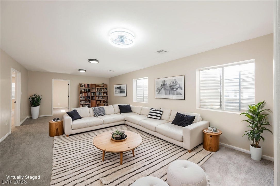601 Sandy Drive, Henderson, NV 89002 Generous windows fill this versatile finished basement living space with abundant natural light.