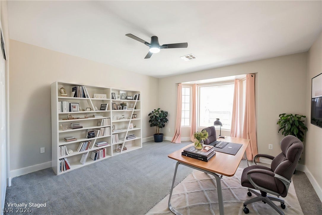 601 Sandy Drive, Henderson, NV 89002 Plentiful natural light streams through a large bay window across soft carpeting.
