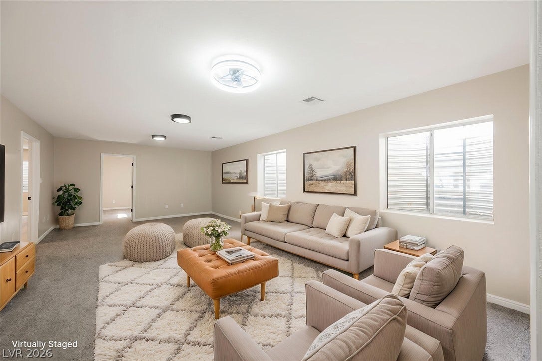 601 Sandy Drive, Henderson, NV 89002 A spacious lower level recreation room includes plush wall-to-wall carpeting and bright egress windows.