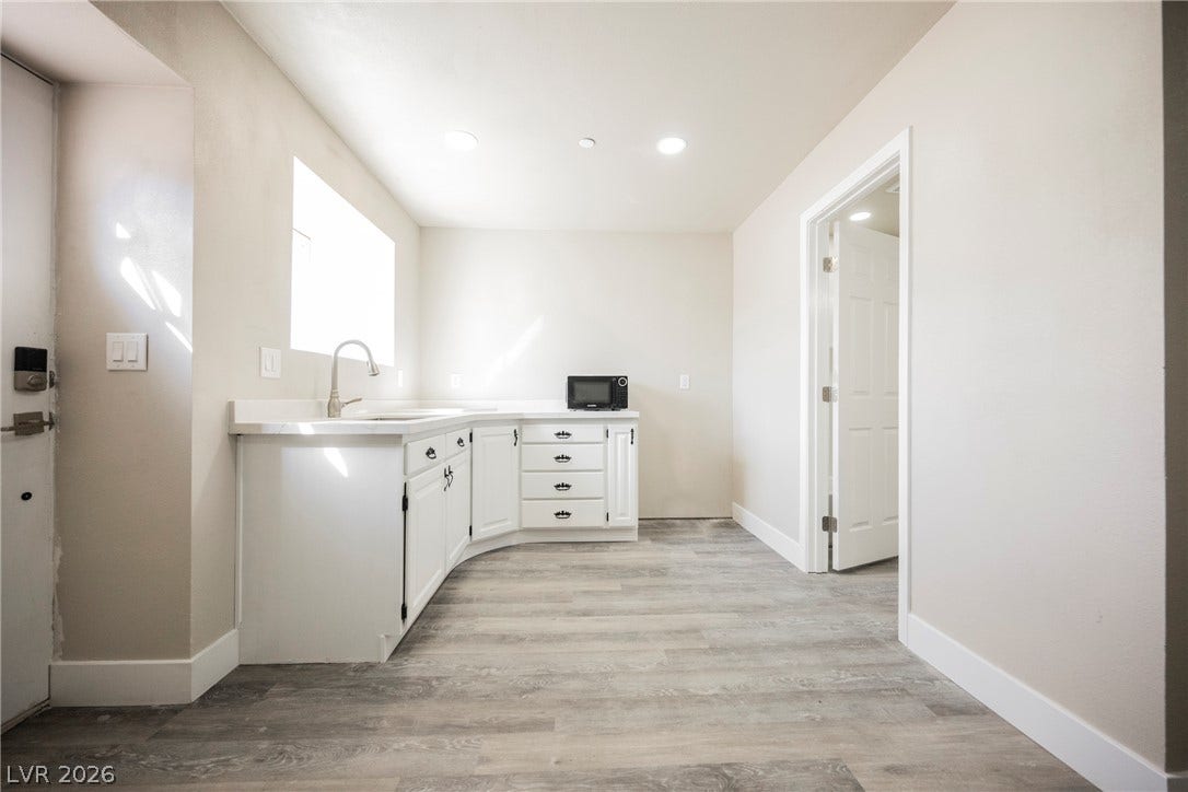 601 Sandy Drive, Henderson, NV 89002 Clean lines and durable wood-look flooring define this versatile utility and workspace.