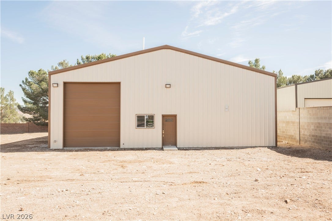 601 Sandy Drive, Henderson, NV 89002 A detached metal workshop provides versatile workspace and secure storage options.