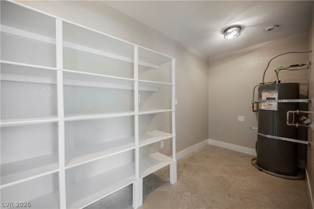 601 Sandy Drive, Henderson, NV 89002 Ample built-in shelving and tile flooring maximize efficiency in this utility space.