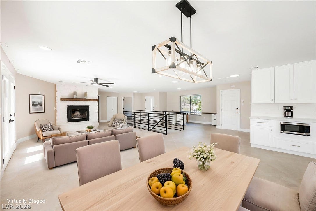 601 Sandy Drive, Henderson, NV 89002 Gleaming concrete floors unite the airy dining area and the welcoming living room.