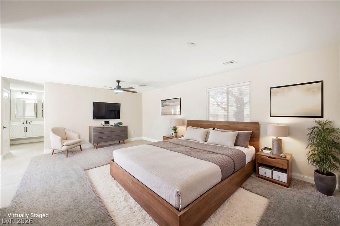 601 Sandy Drive, Henderson, NV 89002 An open doorway links this bedroom suite directly to a private bathroom.