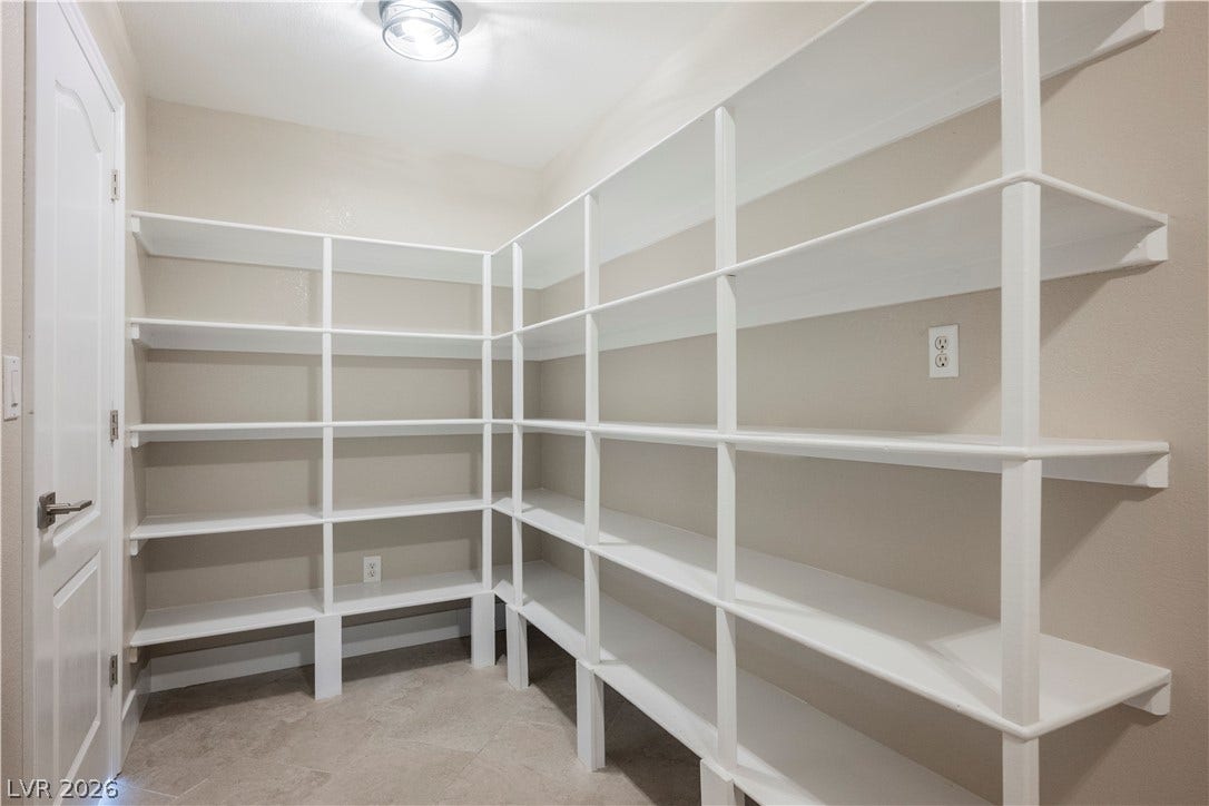 601 Sandy Drive, Henderson, NV 89002 Floor-to-ceiling wrap-around shelving maximize storage efficiency in this dedicated space.