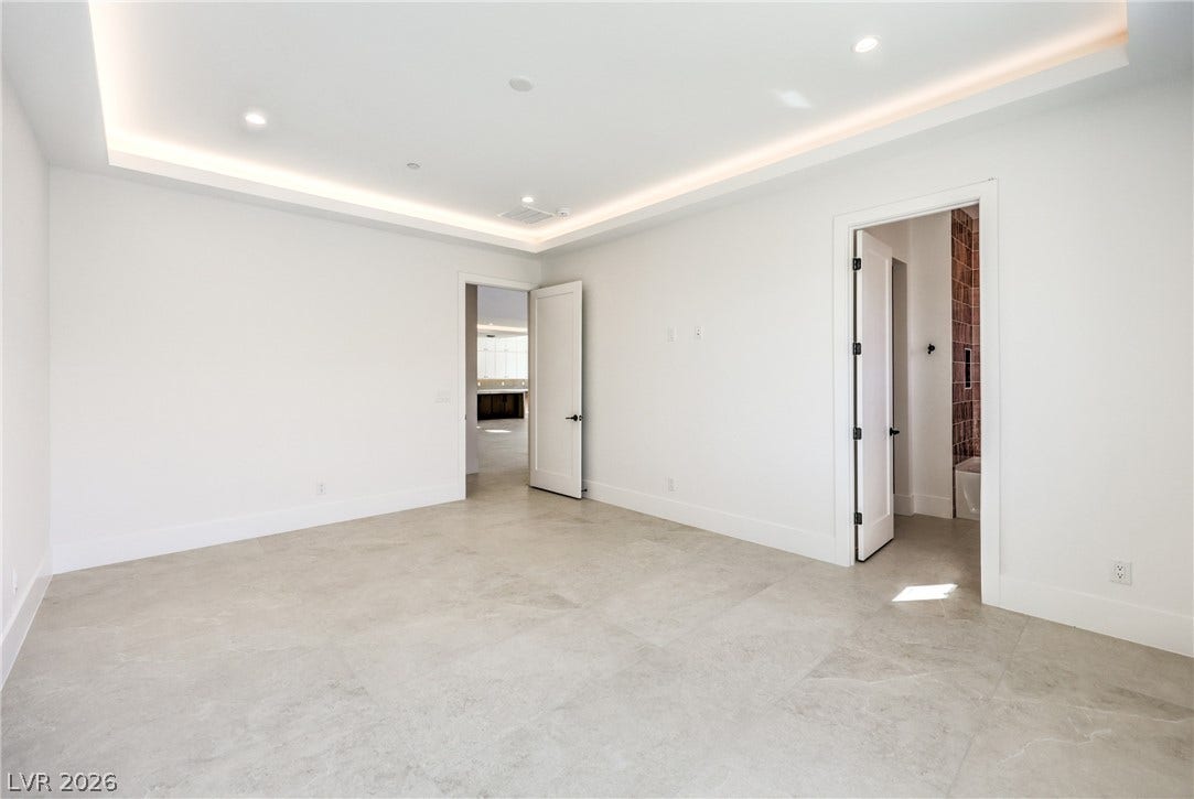 3051 E Serene Avenue, Henderson, NV 89074 Recessed cove lighting accents the clean architectural lines of this versatile space.