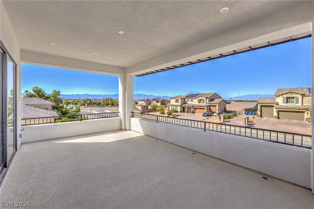 3051 E Serene Avenue, Henderson, NV 89074 A spacious covered balcony provides sweeping views of the surrounding neighborhood and distant mountains.