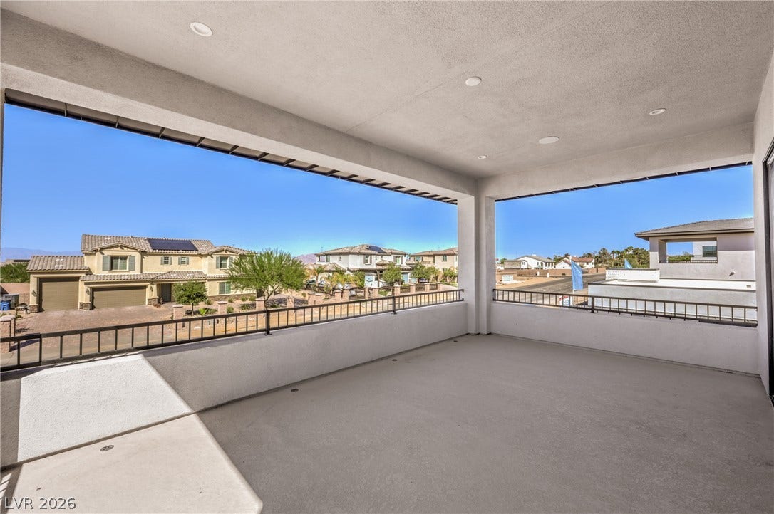 3051 E Serene Avenue, Henderson, NV 89074 An elevated, covered terrace overlooks the peaceful surrounding neighborhood under clear blue skies.