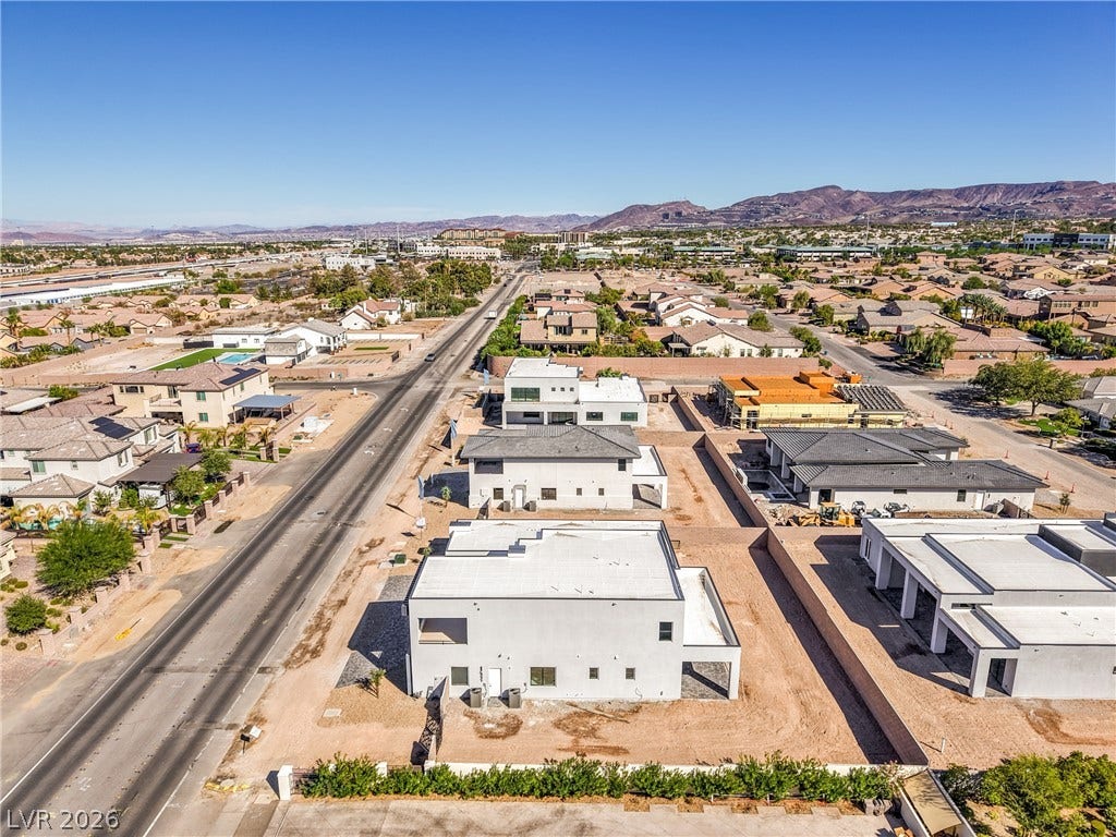 3051 E Serene Avenue, Henderson, NV 89074 Distant mountains frame a sprawling neighborhood view under clear blue skies.